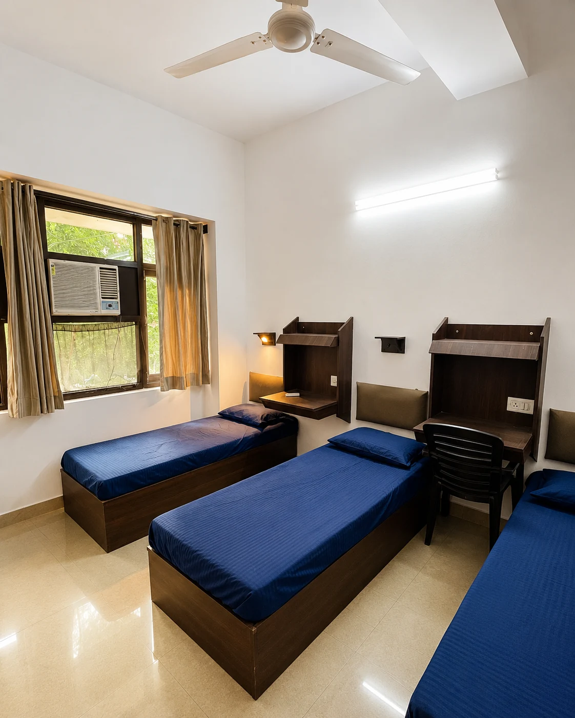 Bright study-ready multi-bed room at Safe House PG