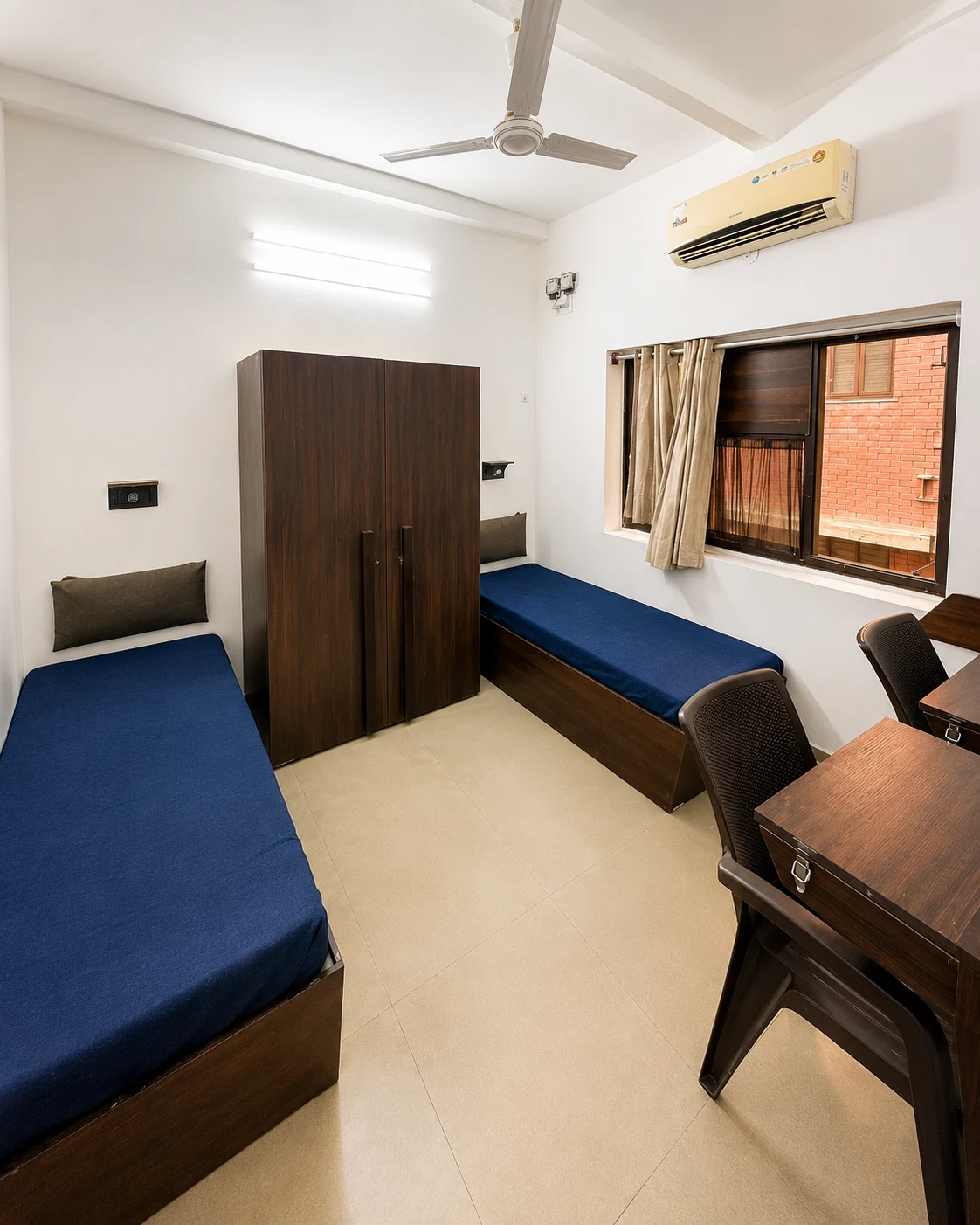 Bright twin-bed room with individual study desks