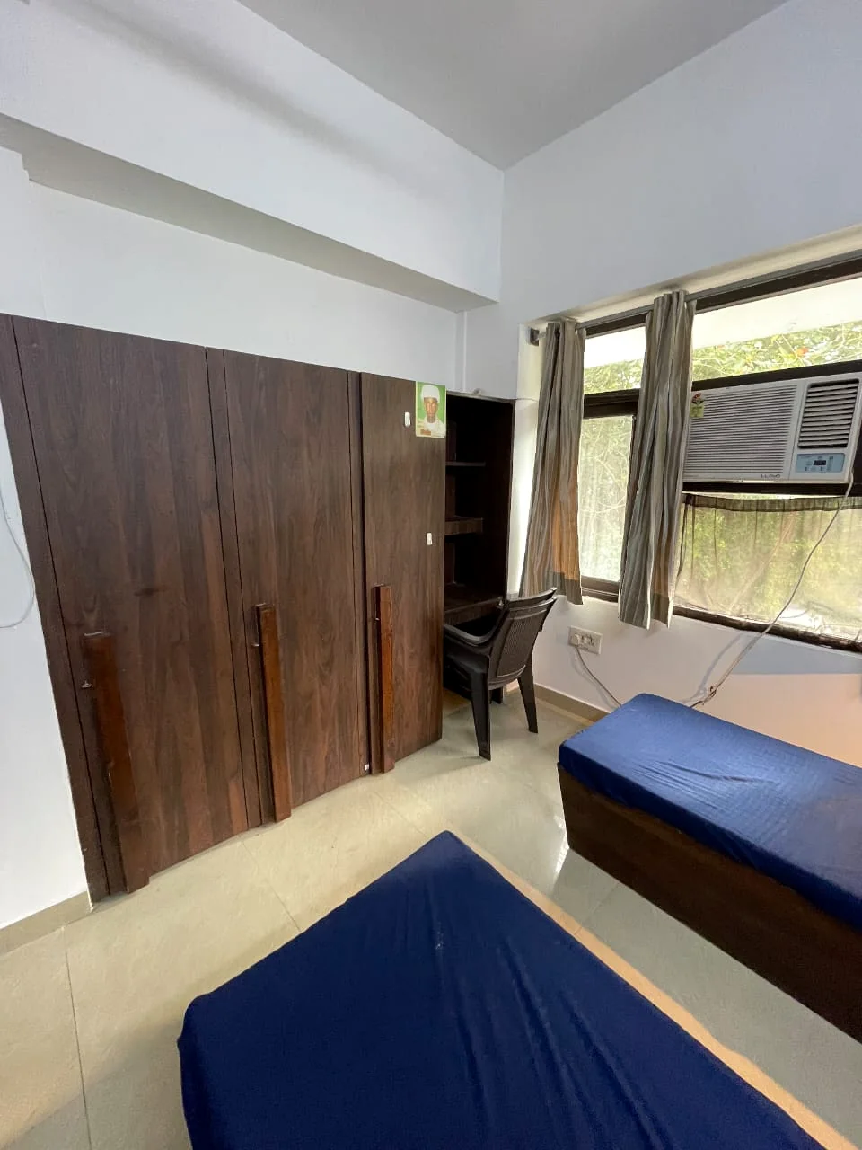 Safe House room showing wardrobes and study storage