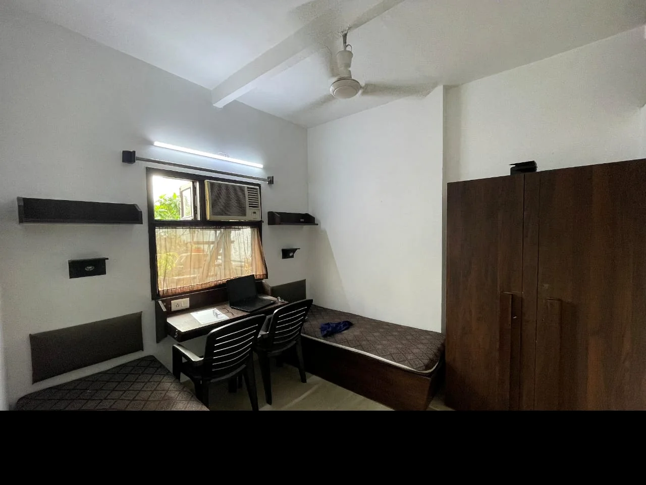 Actual Safe House twin room with study desks